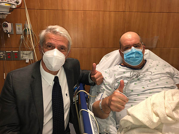 Dr. Pier Giulianotti, director of the Robotic Surgery Program at UI Health, with patient Christopher Adamsickon Sept. 24, 2020. Adamsick is the world’s first polycystic kidney disease patient to receive a robotic double nephrectomy and kidney transplant.