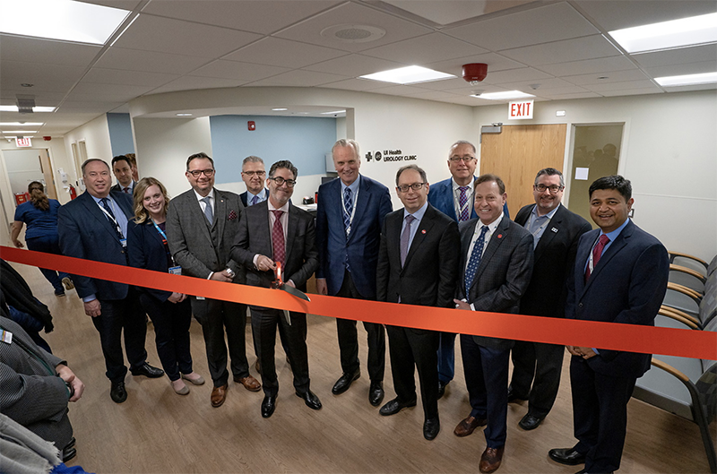 Dr. Craig S. Niederberger, head of the Department of Urology, is joined by department and UI Health leadership as he prepares to cut the ribbon for the ceremonial opening of the new Urology clinic Jan. 17.