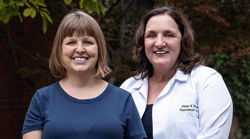 UI Health surgeon Dr. Diane Drugas, right, with patient Faith Isemonger, who was the first person to undergo a robotic-assisted nipple-sparing double mastectomy at UI Health. 