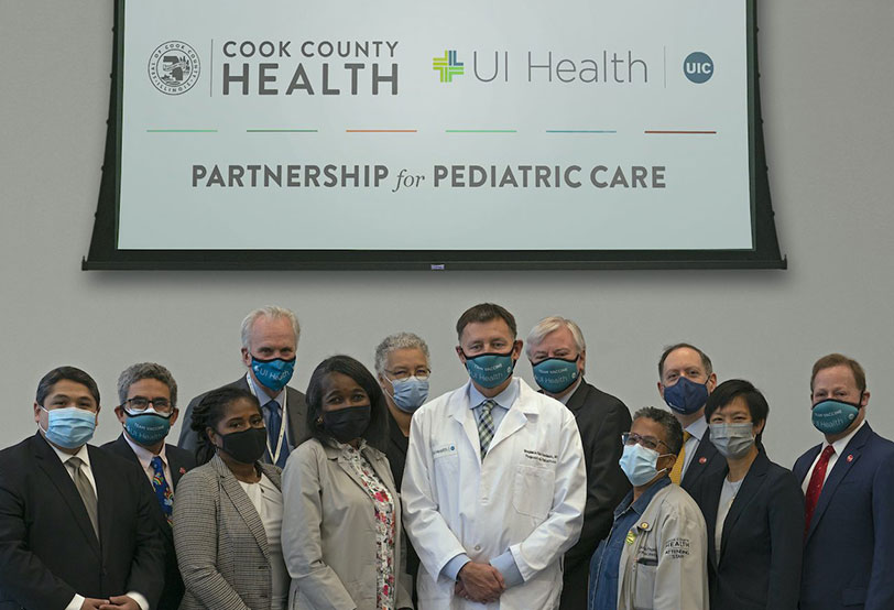 FRONT: CCH CEO Israel Rocha;UICAssociate Dean for Clinical Affairs Dr. Heather Prendergast;CCH Chair of Pediatrics Dr. Mope Akintorin;UI Health Head of Pediatrics Dr. Benjamin Van Voorhees;CCH Chief Medical Officer Dr. Claudia Fegan; UI Health emergency medicinephysicianDr. Janet Lin. BACK: UIC Assistant Vice Chancellor for Research and Executive Vice Head of Pediatrics Dr. Jonathan Klein;University of Illinois Hospital and Clinics CEO Mike Zenn;Cook County Board President Toni Preckwinkle;UIC Chancellor Michael Amiridis;UIC College of Medicine Executive Dean Dr. Mark Rosenblatt;UIC Vice Chancellor for Health Affairs Dr. Robert Barish.