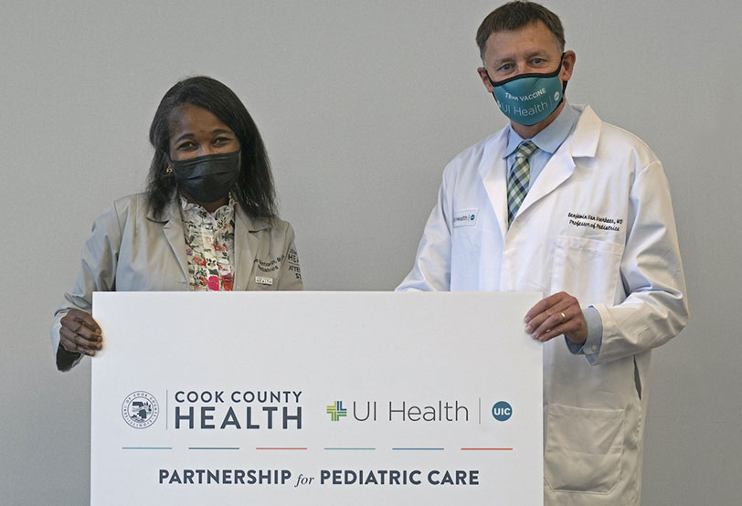 Dr. Mope Akintorin, chair of pediatrics at Cook County Health, and Dr. Benjamin Van Voorhees, head of Pediatrics at UI Health.