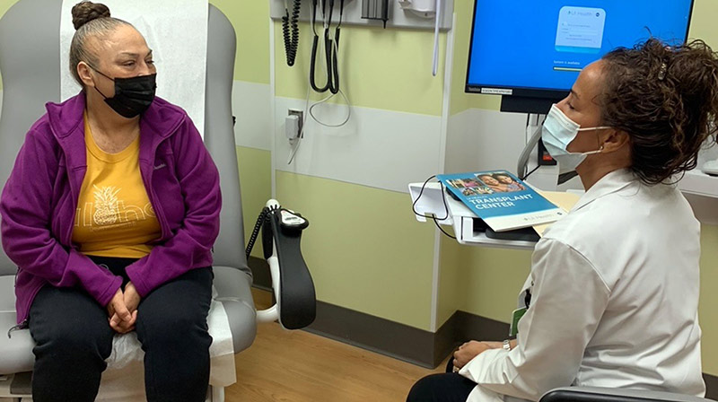 Jose Gomez, of Chicago, visits with UI Health transplant surgeon Dr. Jorge Almario Alvarez the Spanish Language Kidney Transplant Clinic.