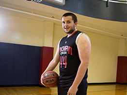 Mike Armstrong lost his freshmen year of basketball to a freaky bone cyst. Now the varsity player is back to scoring in the paint.