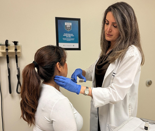 Dr. Yasaman Kianirad examines patient