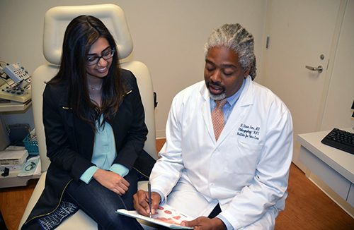 A doctor consulting with a patient.